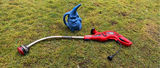 Red electric string trimmer and blue garden gnome statue - thumbnail 1 of 3