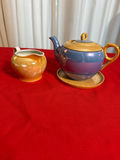 Glazed ceramic teapot with matching creamer and lid - thumbnail 1 of 5