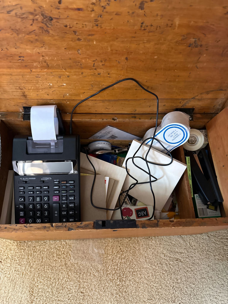 Wooden storage trunk with calculator and papers - image 2 of 2