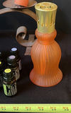Assorted fragrance bottles, diffuser, and decorative candlesticks - thumbnail 5 of 13