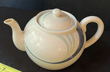 Ceramic teapot, blue-glazed jug, and Kokeshi doll with display plaque - thumbnail 2 of 9