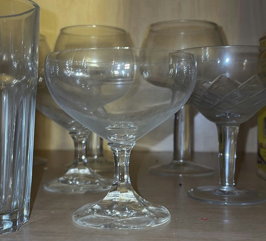 Glassware collection: clear ribbed tumblers, goblets, and a green corked jar - image 6 of 8