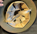 Two vintage helmets: Brodie-style steel helmet with insignia and a pith helmet - thumbnail 9 of 10
