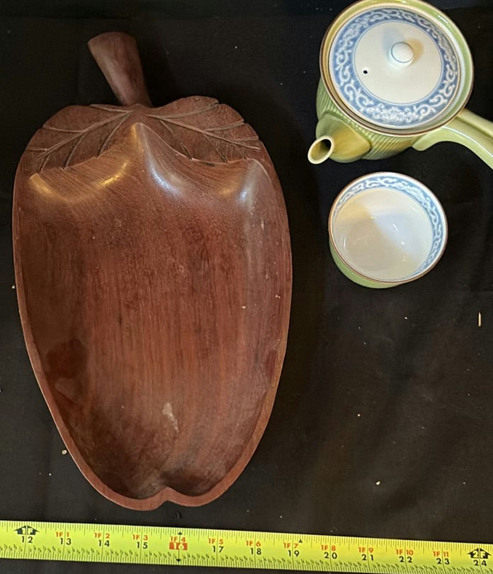 Ceramic teapot set, large glaze plate, wooden leaf vessel, and patterned fabrics - image 4 of 7
