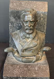 Stone bust bookend pair with skull and serpent motif - thumbnail 2 of 6