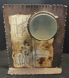 Mixed-media art piece with circular lens and disc, plus storage containers and incense - thumbnail 3 of 5