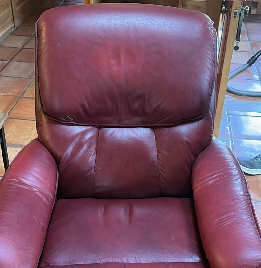 Dark gray fabric recliner and burgundy leather recliner - image 10 of 15