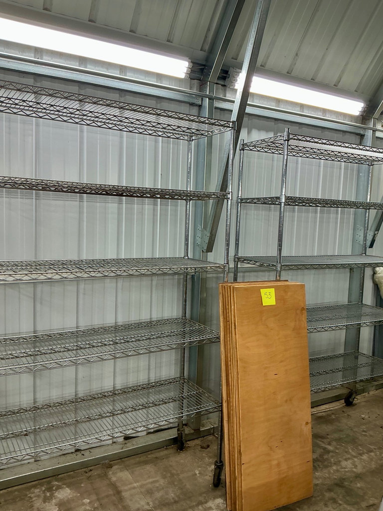Mobile wire shelving units with plywood boards - image 1 of 3