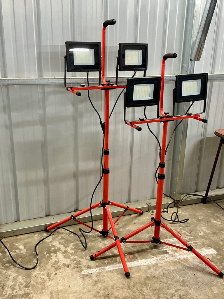 LED floodlights on red tripod stands - image 1 of 3