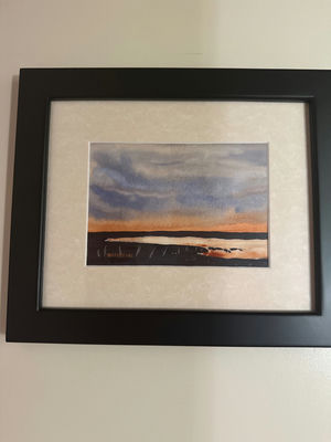Framed landscape painting with blue sky and orange horizon - Image 1 of 2