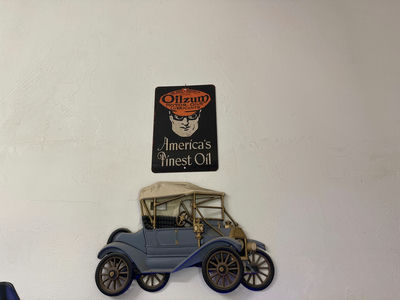 Vintage car wall art and Monroe advertisement sign - Image 1 of 2