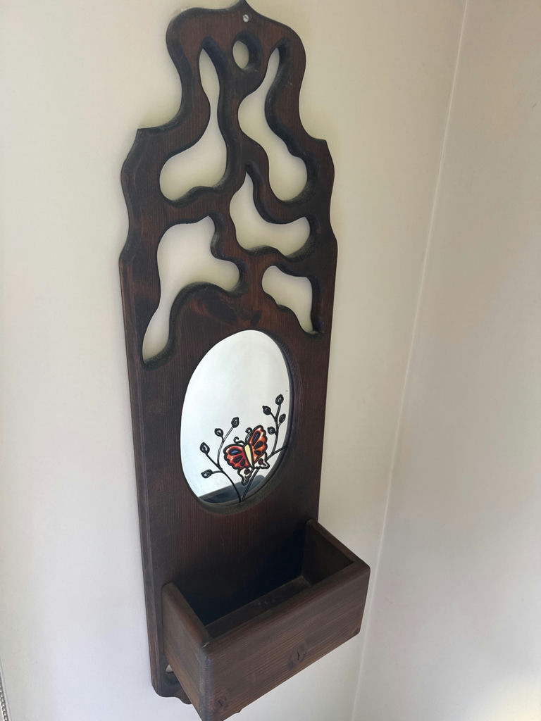 Wooden wall-mounted decorative panel with oval mirror and small shelf - image 2 of 2