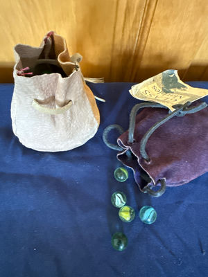 Glass marbles in fabric pouches - Image 1 of 4