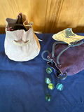 Glass marbles in fabric pouches - thumbnail 1 of 4