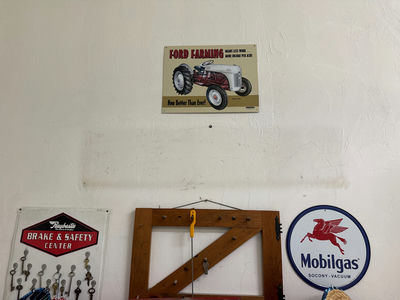 Vintage automotive signs, keys, and frame saw - Image 1 of 3