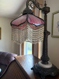 Vintage table lamp with pink shade and bead fringe - thumbnail 1 of 3