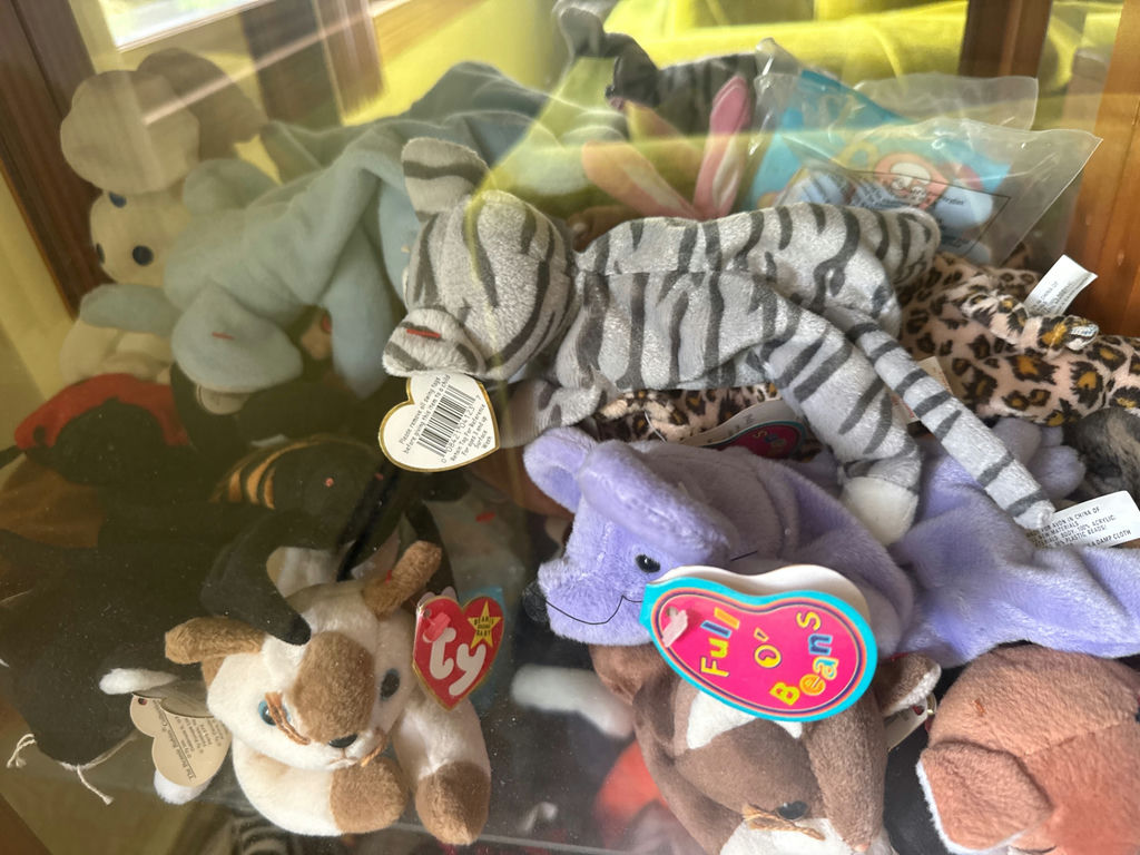 Glass display cabinet with plush stuffed animals - image 3 of 5