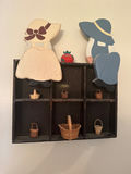 Wall-mounted cubby shelf with two wooden figures and mini baskets - thumbnail 2 of 2