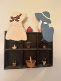 Wall-mounted cubby shelf with two wooden figures and mini baskets - thumbnail 1 of 2