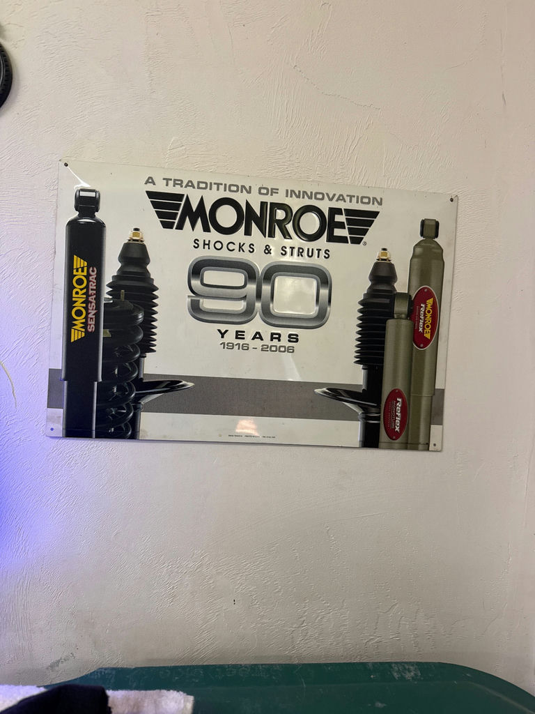 Vintage car wall art and Monroe advertisement sign - image 2 of 2