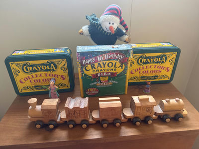 Wooden toy train set with Crayola crayon tins and snowman plush - Image 1 of 2
