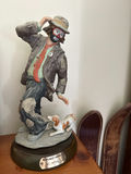 Figurine of a man with a dog - thumbnail 1 of 3