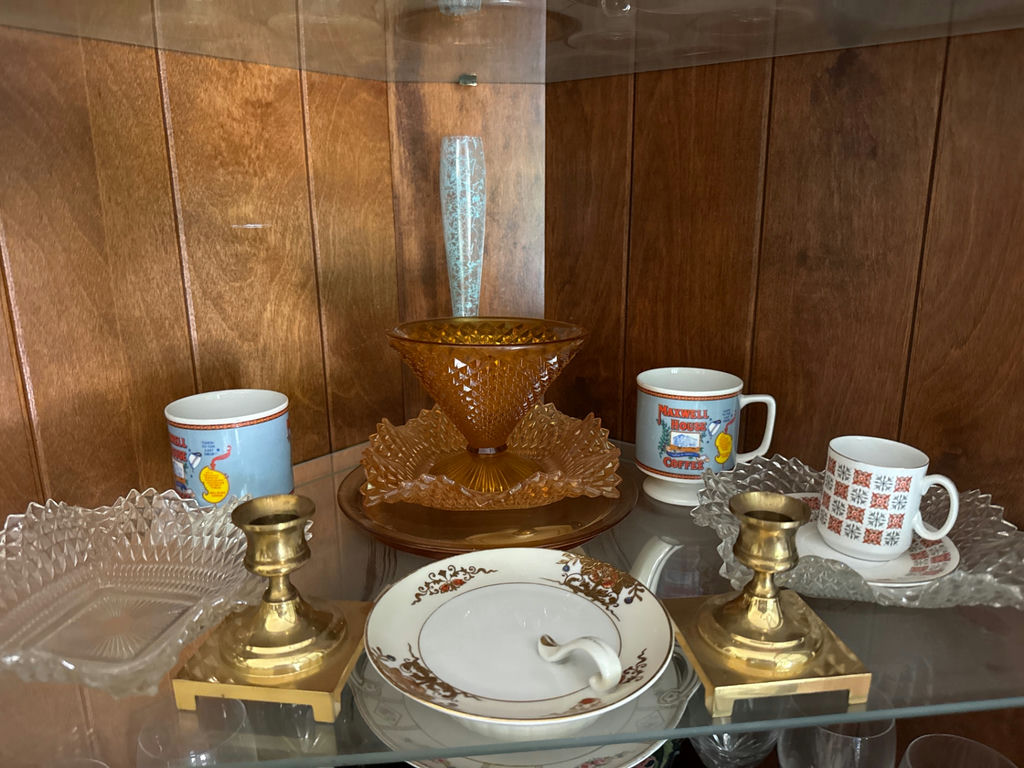 Amber glass compote with crystal dishes and brass candlesticks alongside mugs - image 1 of 4