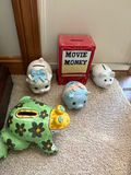 Assorted coin banks including piggy banks and Movie Money box - thumbnail 1 of 1