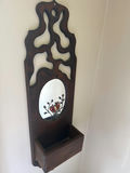 Wooden wall-mounted decorative panel with oval mirror and small shelf - thumbnail 1 of 2