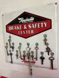 Vintage automotive signs, keys, and frame saw - thumbnail 3 of 3