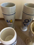 Two ceramic beer steins, a novelty mug, and a ceramic pour-over dripper - thumbnail 3 of 7