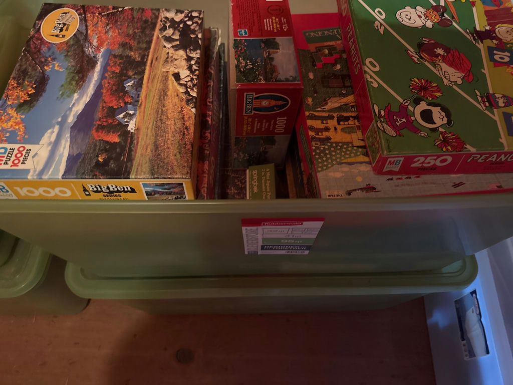 Assorted jigsaw puzzles in storage bins - image 3 of 4