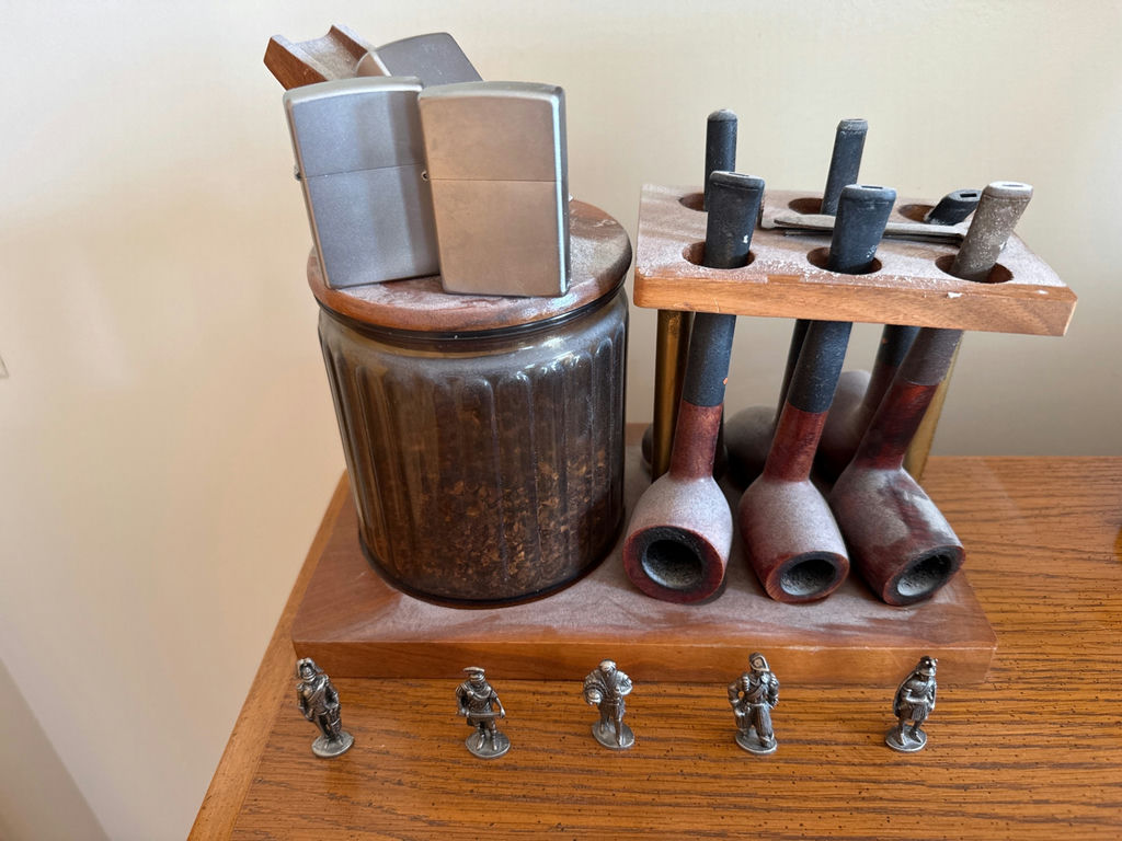 Vintage tobacco pipe display with jars and lighters - image 1 of 2