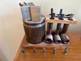 Vintage tobacco pipe display with jars and lighters - thumbnail 1 of 2