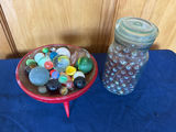Assorted marbles in a red pedestal dish and glass jar - thumbnail 2 of 2