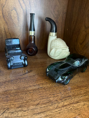 Assorted miniature vehicles and smoking pipes - Image 1 of 1