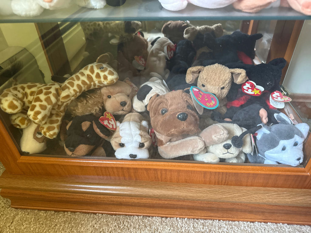 Glass display cabinet with plush stuffed animals - image 5 of 5