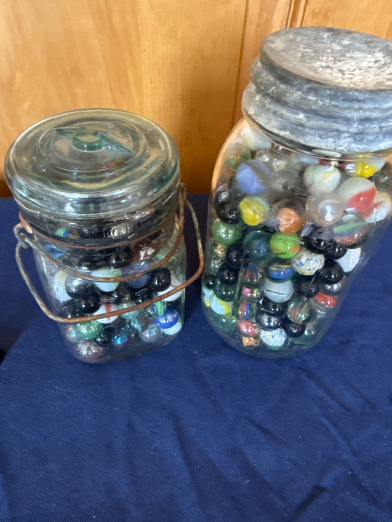 Two glass jars filled with colorful marbles - image 1 of 2