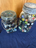 Two glass jars filled with colorful marbles - thumbnail 1 of 2