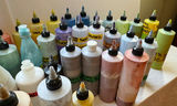 Assorted liquid paints and colorants in squeeze bottles - thumbnail 4 of 11