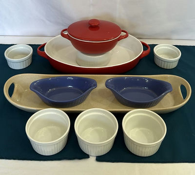 Red enamel Dutch oven with lid, blue oval bowls, beige rectangular tray, and white ramekins - Image 1 of 9