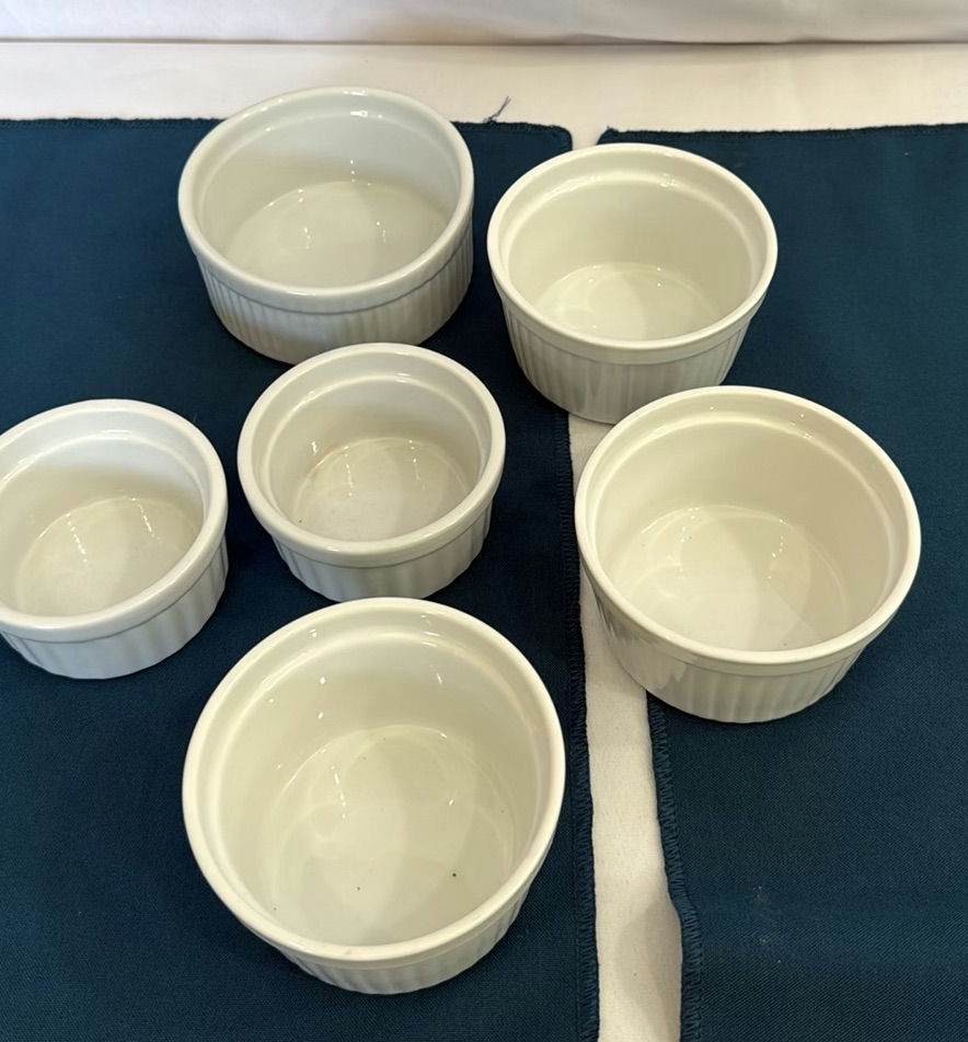 Red enamel Dutch oven with lid, blue oval bowls, beige rectangular tray, and white ramekins - image 8 of 9