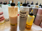 Assorted liquid paints and colorants in squeeze bottles - thumbnail 5 of 11