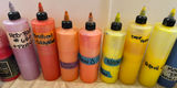 Assorted liquid paints and colorants in squeeze bottles - thumbnail 10 of 11