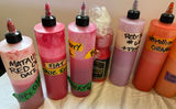 Assorted liquid paints and colorants in squeeze bottles - thumbnail 9 of 11