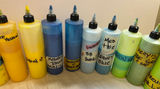 Assorted liquid paints and colorants in squeeze bottles - thumbnail 11 of 11