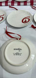 Twelve white ceramic plates with red numerals 1–12 and bird motif, each with red hanging ribbon - thumbnail 5 of 5