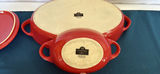 Red enamel Dutch oven with lid, blue oval bowls, beige rectangular tray, and white ramekins - thumbnail 4 of 9
