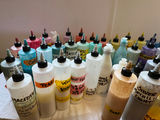 Assorted liquid paints and colorants in squeeze bottles - thumbnail 3 of 11
