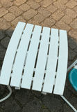 Outdoor patio furniture set: turquoise mesh chairs with white frames, a white folding table, and stacked white folding chairs - thumbnail 3 of 6